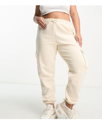River Island Plus cargo pants with pocket detail in beige-Neutral