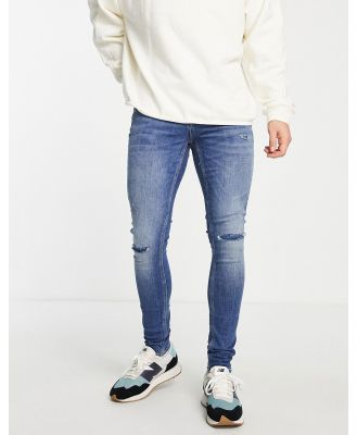 River Island spray on jeans with rips in medium blue