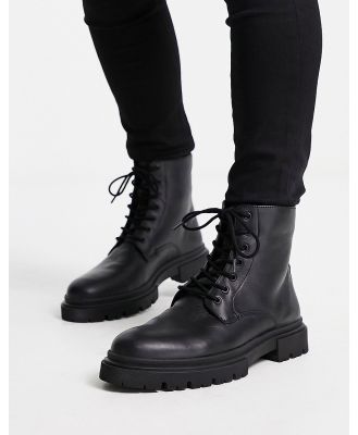 schuh Dane chunky lace up boots in black leather