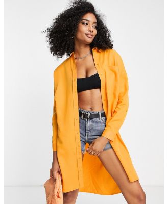 Selected Femme oversized shirt with belt in orange