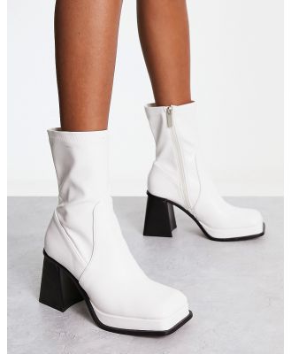 Shellys London Jupiter sock boots in white high shine patent
