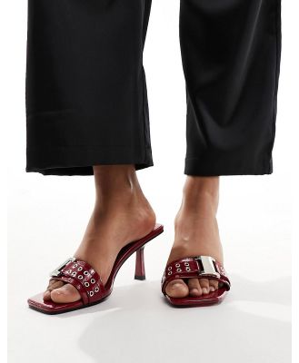Simmi London Bexley mid heeled mules with eyelet buckle detail in red