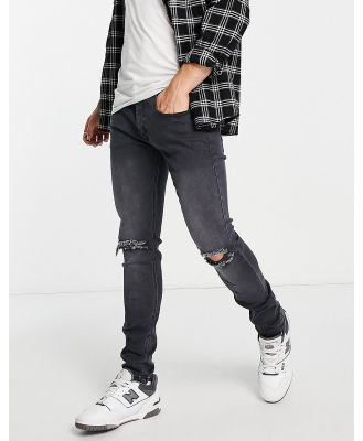 Soul Star skinny fit ripped jeans in washed black