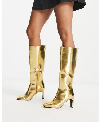 Stradivarius knee high boots in gold