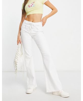 Stradivarius lace up flare jeans in white