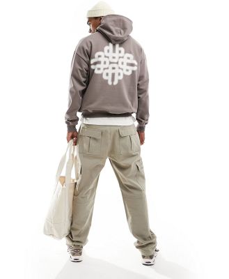 The Couture Club blurred emblem graphic hoodie in brown