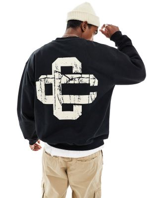 The Couture Club cracked print emblem sweatshirt in black
