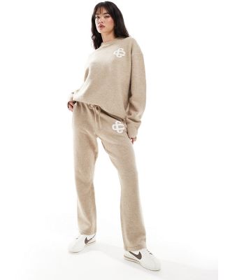 The Couture Club fluffy emblem knitted pants in beige-Neutral