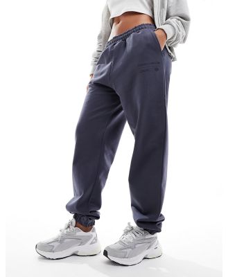 The Couture Club graphic relaxed trackies in petrol blue-Navy