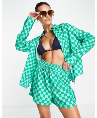 The Frolic Corallia shorts in green checkerboard print (part of a set)