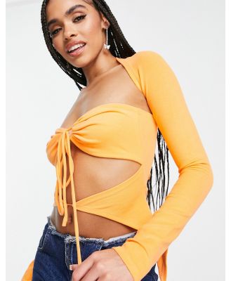 The Kript extreme cut out long sleeve crop top in orange