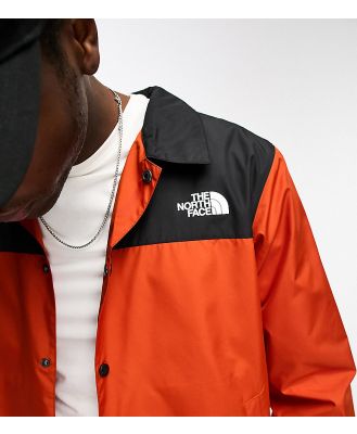 The North Face Coach jacket in orange and black Exclusive at ASOS