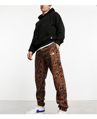 The North Face Essential oversized trackies in brown marble print Exclusive at ASOS