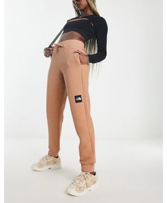 The North Face NSE Mhysa quilted trackies in brown