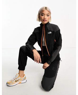 The North Face NSE shell suit track top in black and grey