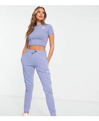 The North Face skinny trackies in blue Exclusive at ASOS