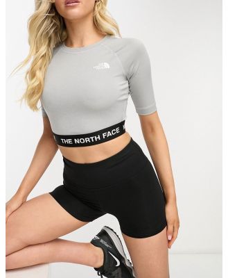 The North Face Training cropped long sleeve performance top in grey