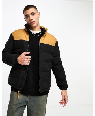 Timberland Welch Mountain puffer jacket in black with wheat yoke detailing