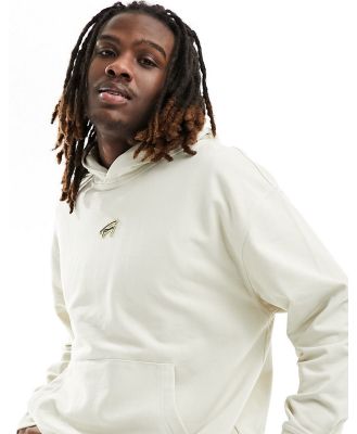 Tommy Jeans relaxed signature logo hoodie in beige-Neutral