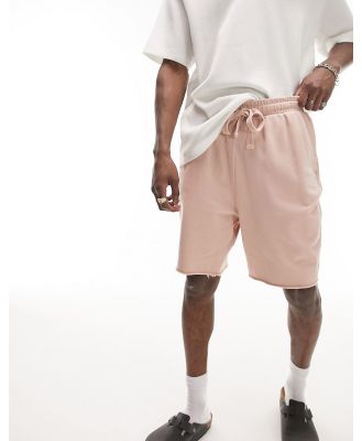 Topman oversized shorts with raw hem in washed pink-Brown