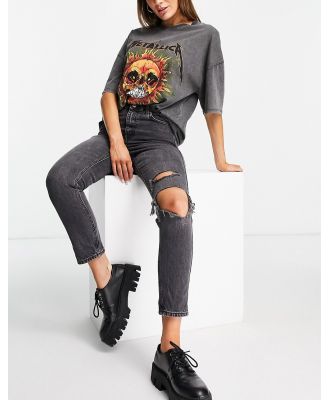 Topshop mom jeans with knee rip in washed black