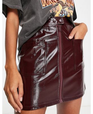 Topshop patent zip front pocket mini skirt in burgundy-Red