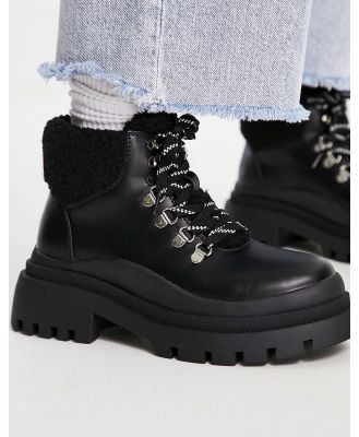 Truffle Collection chunky borg lined hiker boots in black
