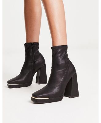 Truffle Collection platform square toe boots with trim in black