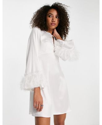 Twisted Wunder cut out mini dress with faux feather cuffs-White
