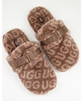Ugg Fluff It pop sheepskin slippers in all over logo print brown