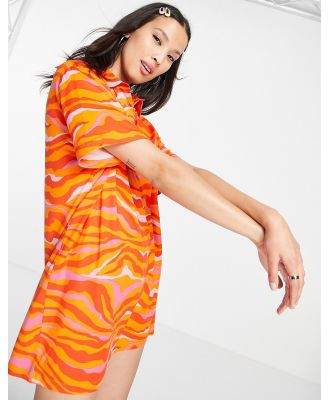 Urban Threads oversized polo dress in orange swirl print