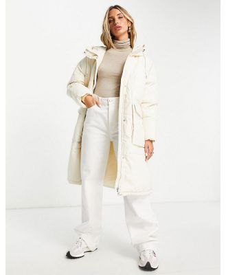 Vero Moda longline padded coat with elasticated waist in cream-White