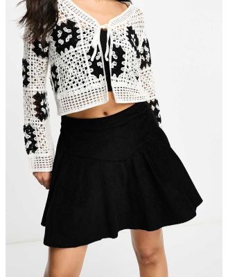 Violet Romance cord pleated mini skirt in black